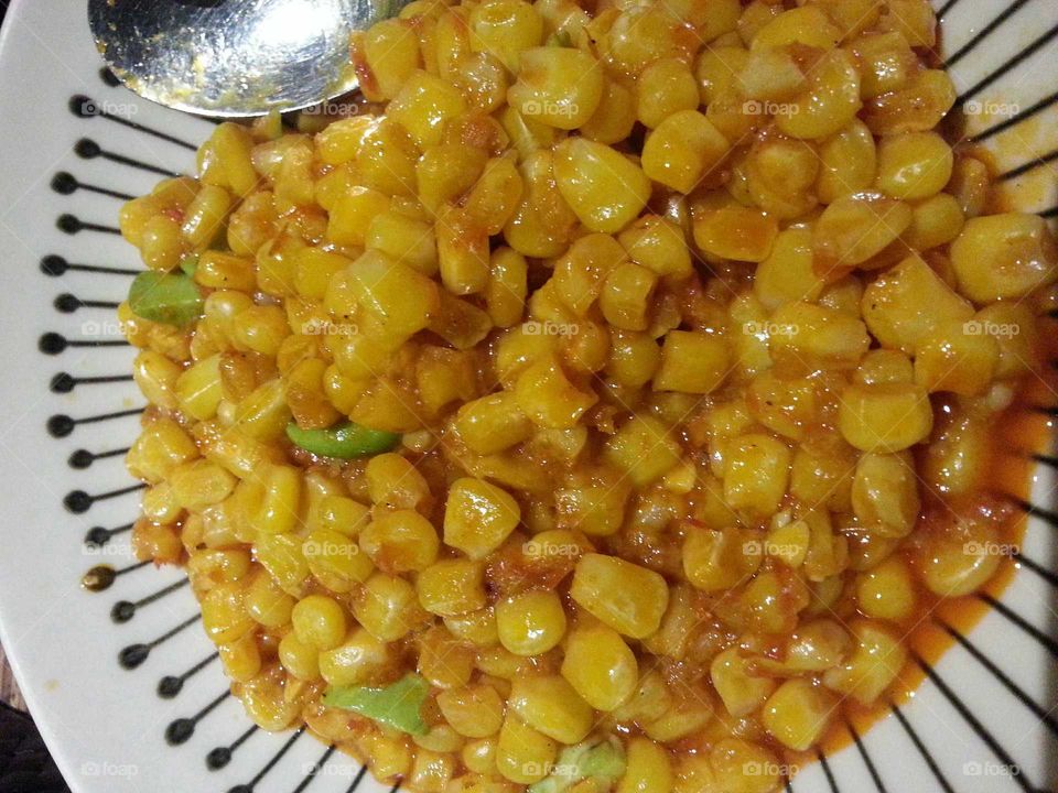 Oseng Jagung Madura;
A Maduranese sauteed corn with petai bean and chilly oil.