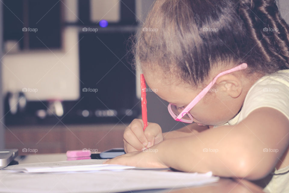 Little girl doing her homework