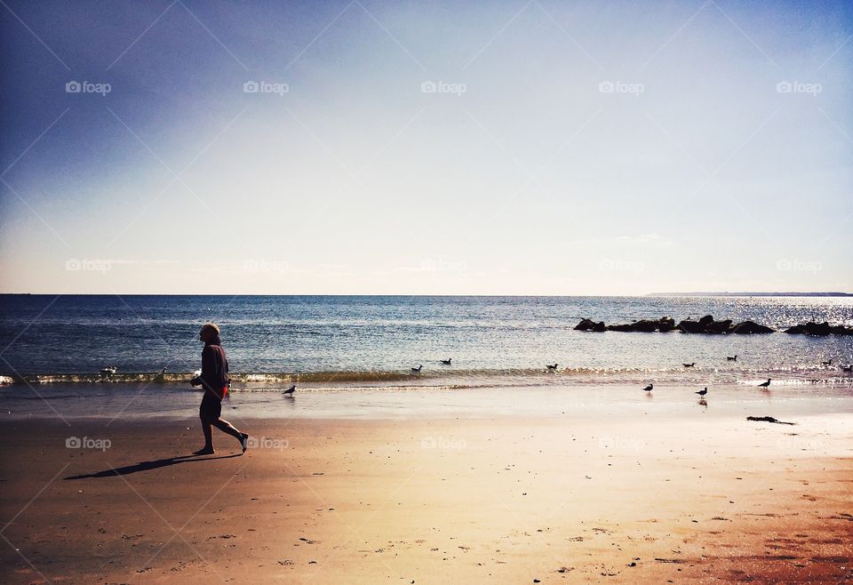 Walking on a beach with seagulls