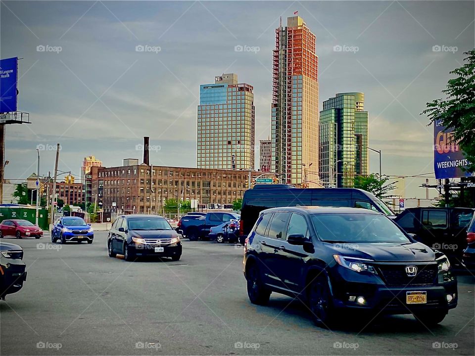 This is the corner of „Vernon Jackson Ave“ and „Borden Ave“ by the „East River“ at „Newtown Creek“ in Long Island City, Queens, NY by the „Pulaski Bridge“. The sun is about to set behind the horizon. 2032. Hypnotic Productions