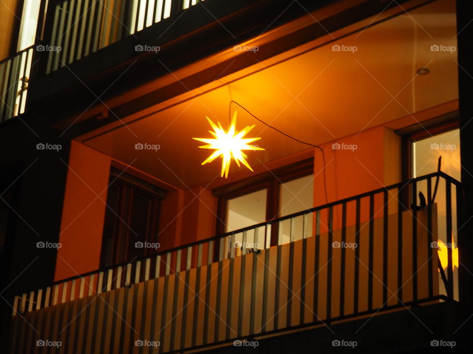 Christmas lights on a balcony in the night