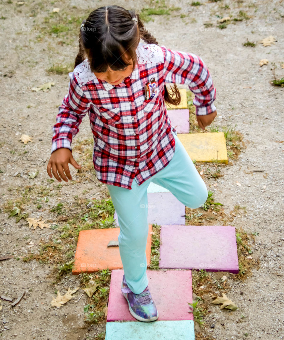 Playing hopscotch in summer