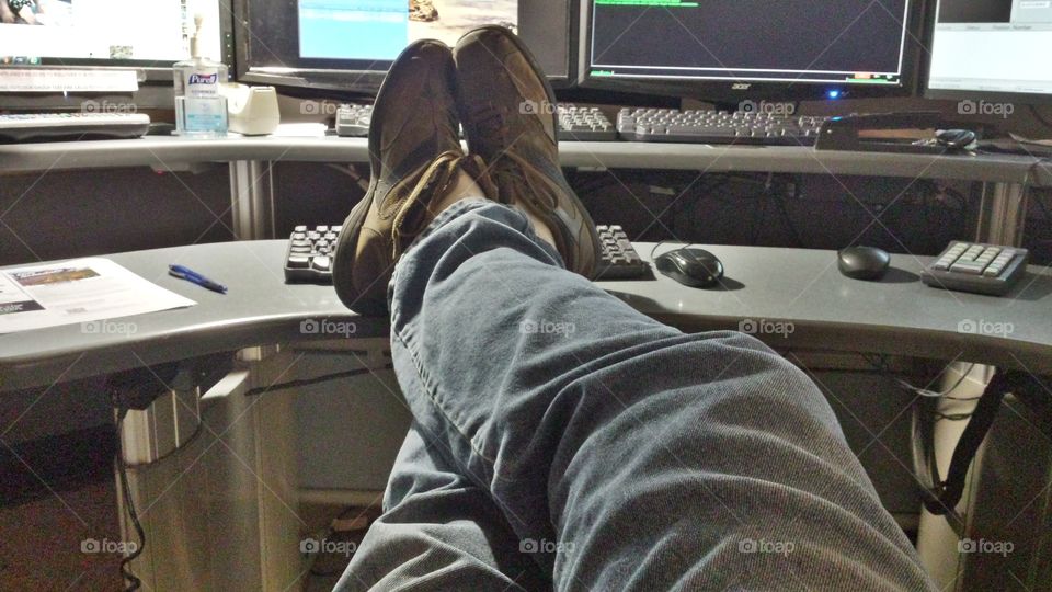Slacking at work. Working late night with my feet up relaxing.
