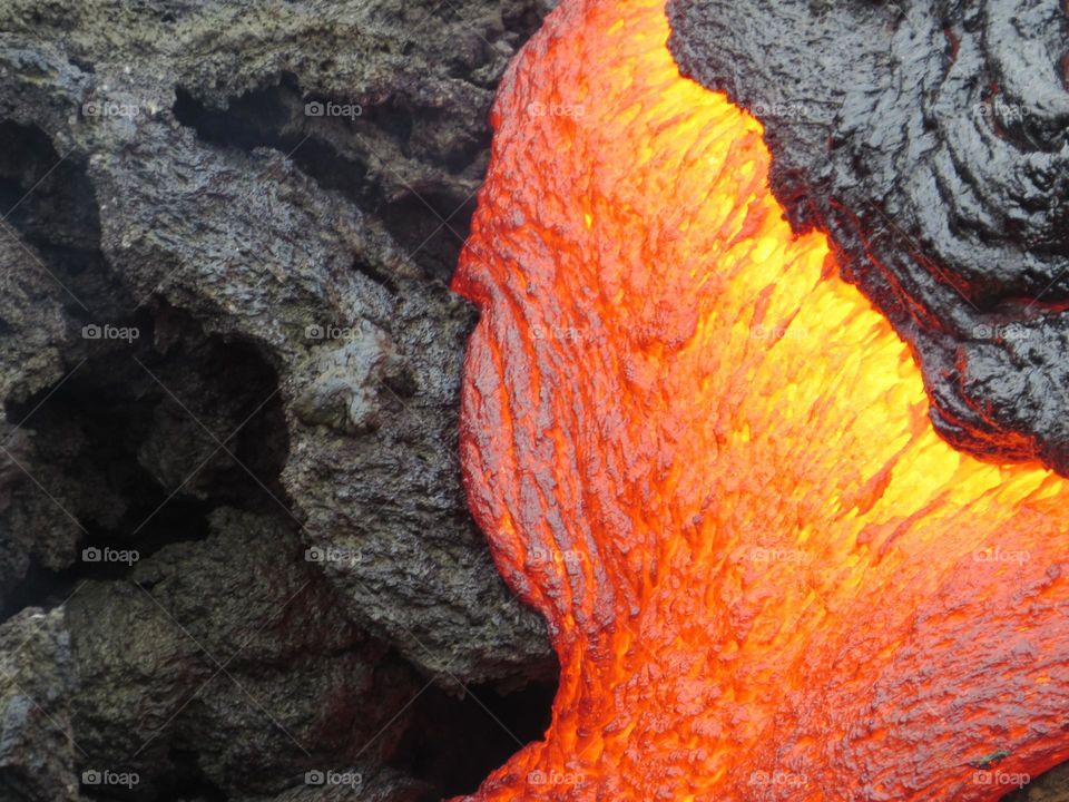 Bright colors of orange and yellow lava versus the black fresh lava rock