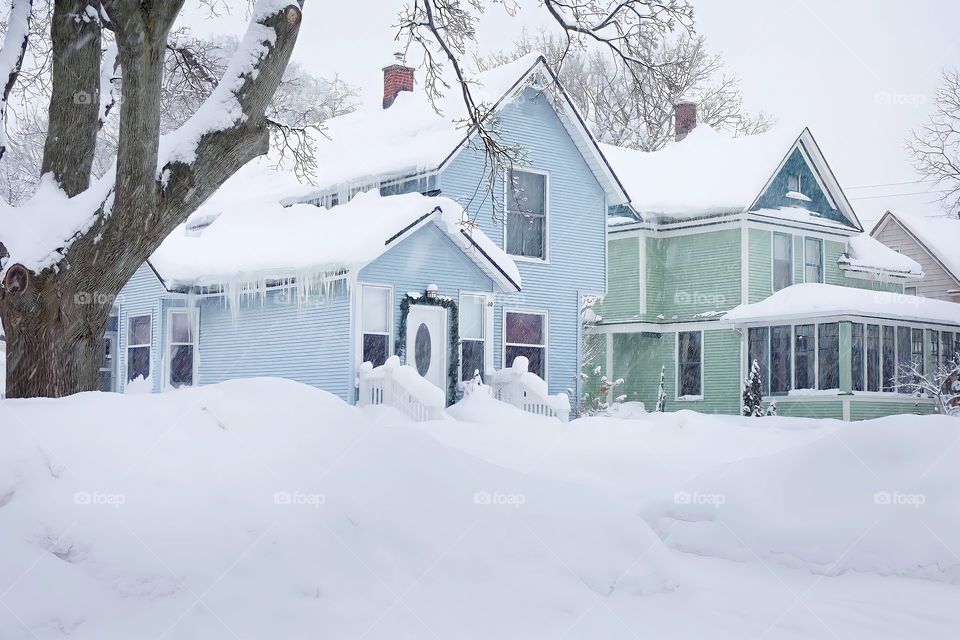 Houses in Snowfall
View of row of houses covered in snow