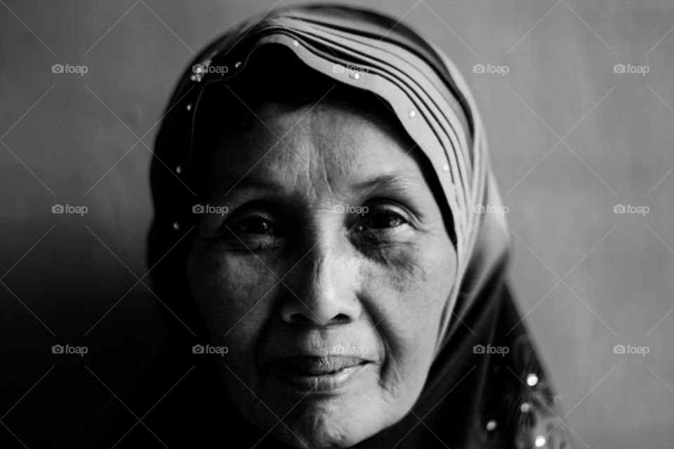 Portrait of senior woman in headscarf