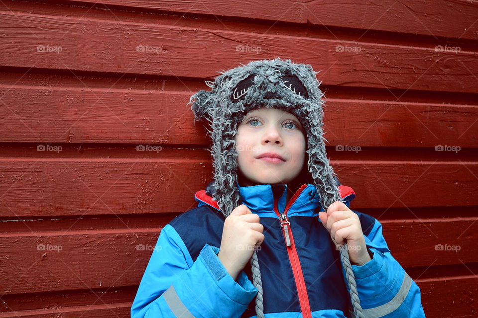 Cute boy with a hat on monochrome background