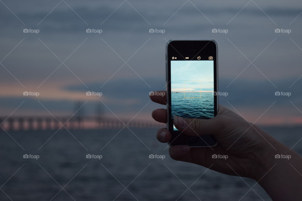 Øresundbridge Malmö. I'm taking a picture of my sister that is taking a picture of the Øresundbridge