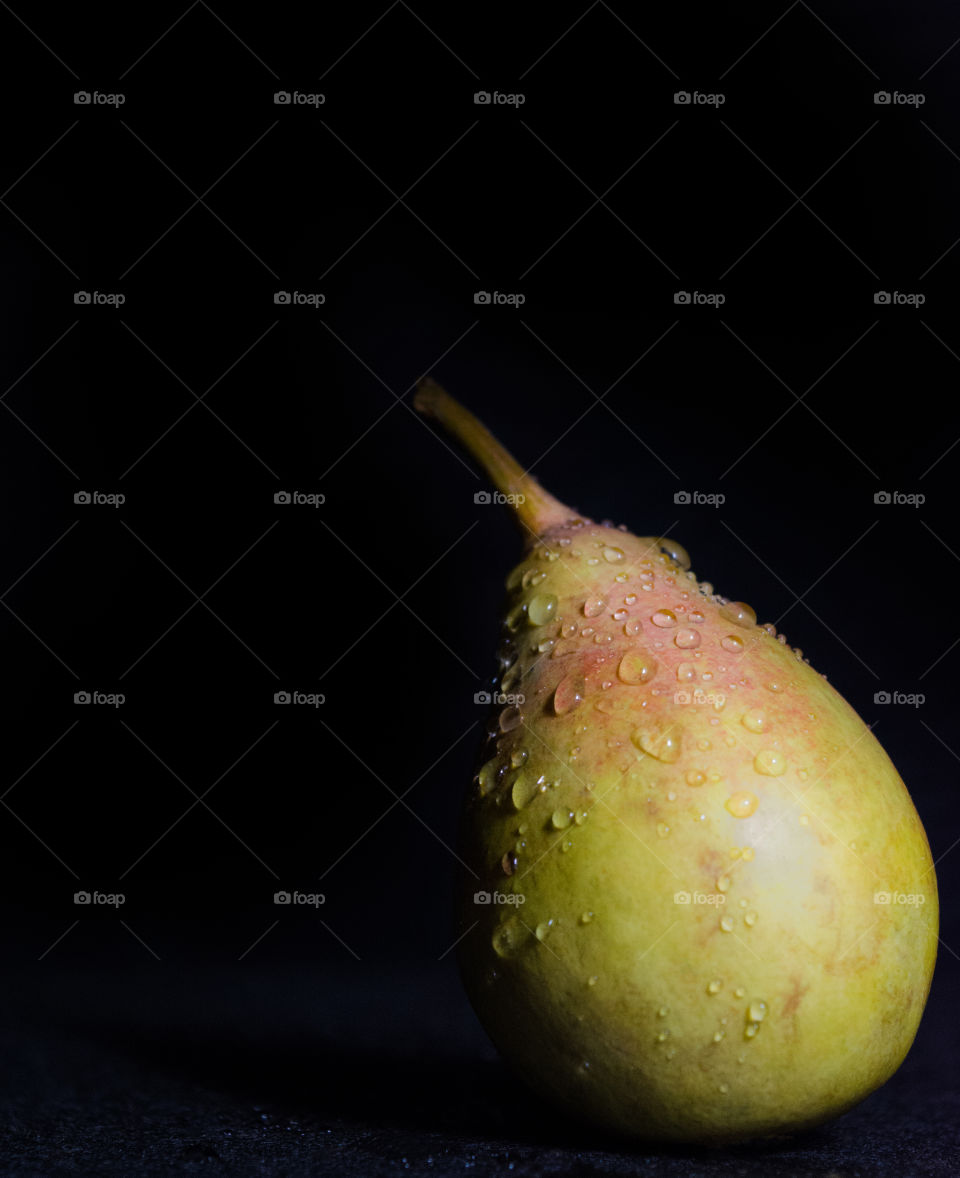 Pear on a black background.
