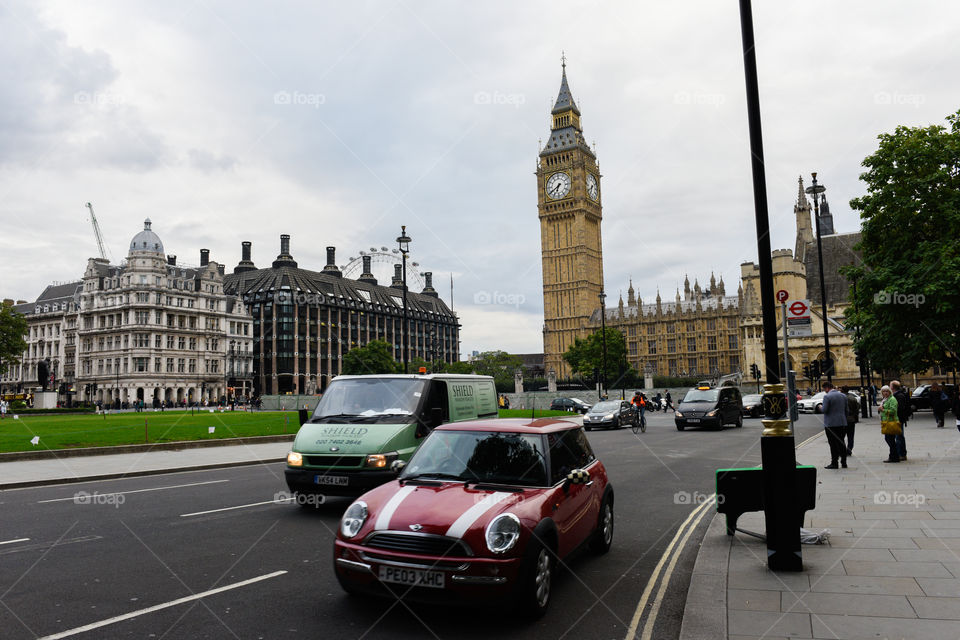 Traffic and tourists near Big Ben in London.