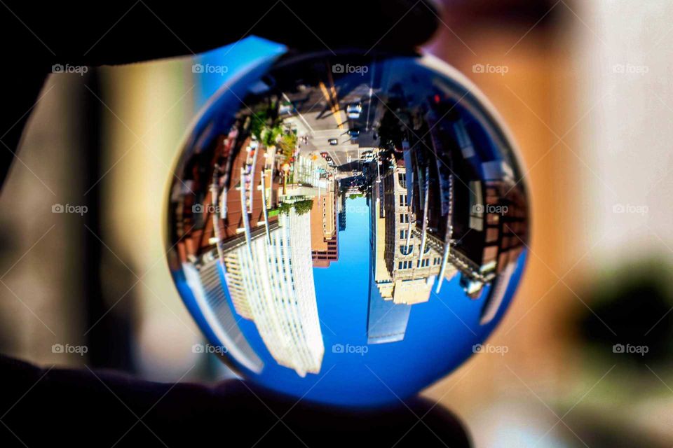 A new perspective on 16th Street through the glass sphere which creates a rounded world with colors for the buildings