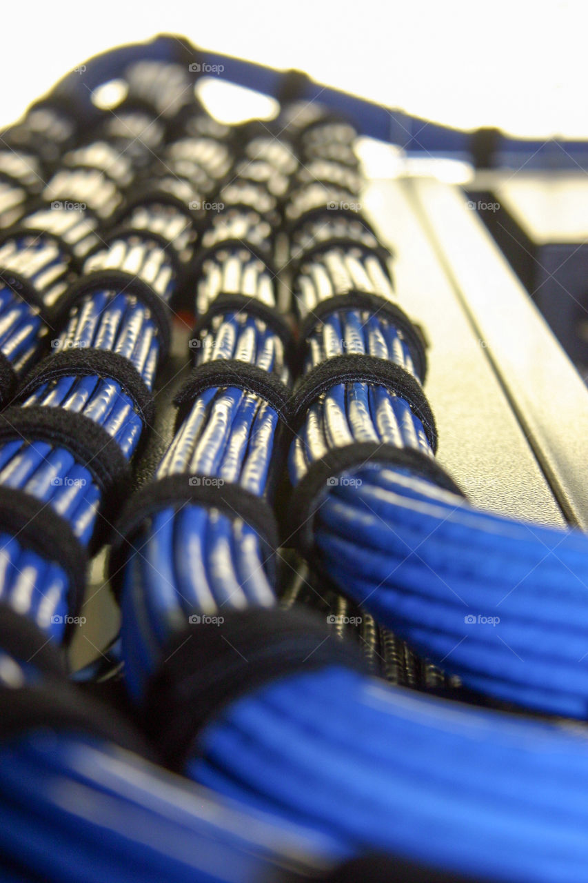 Bundled blue cables in a server room