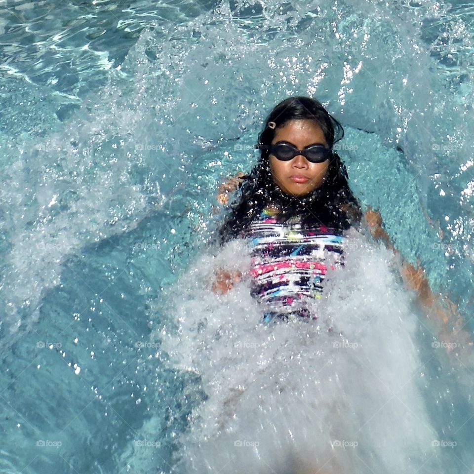 Girl swimming in pool 