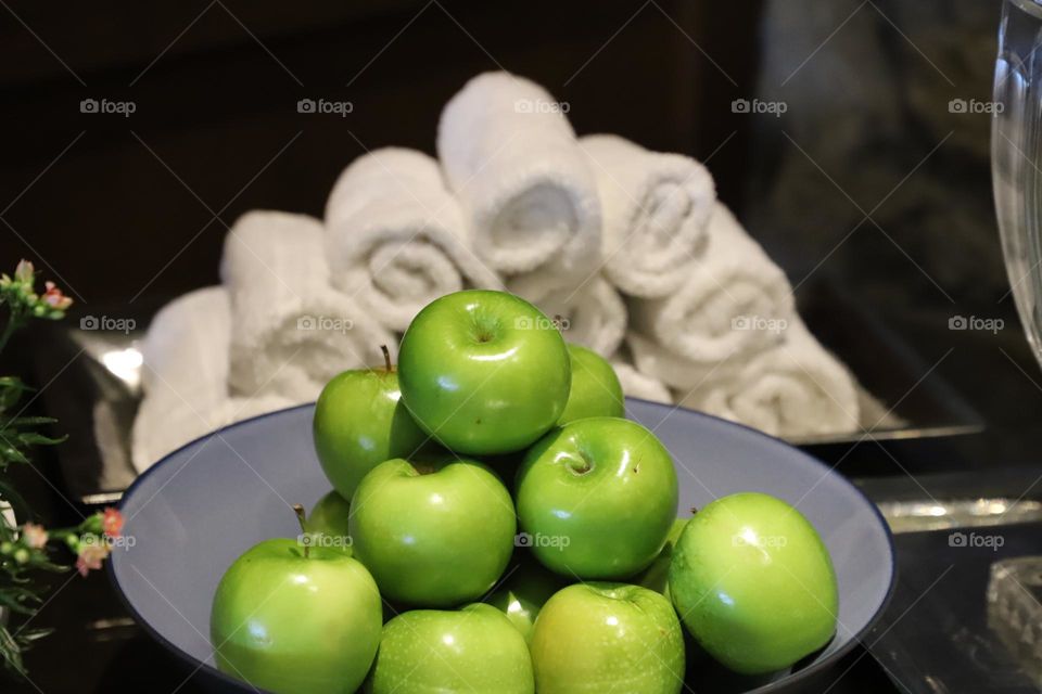 Green apple i from of rolled towels 