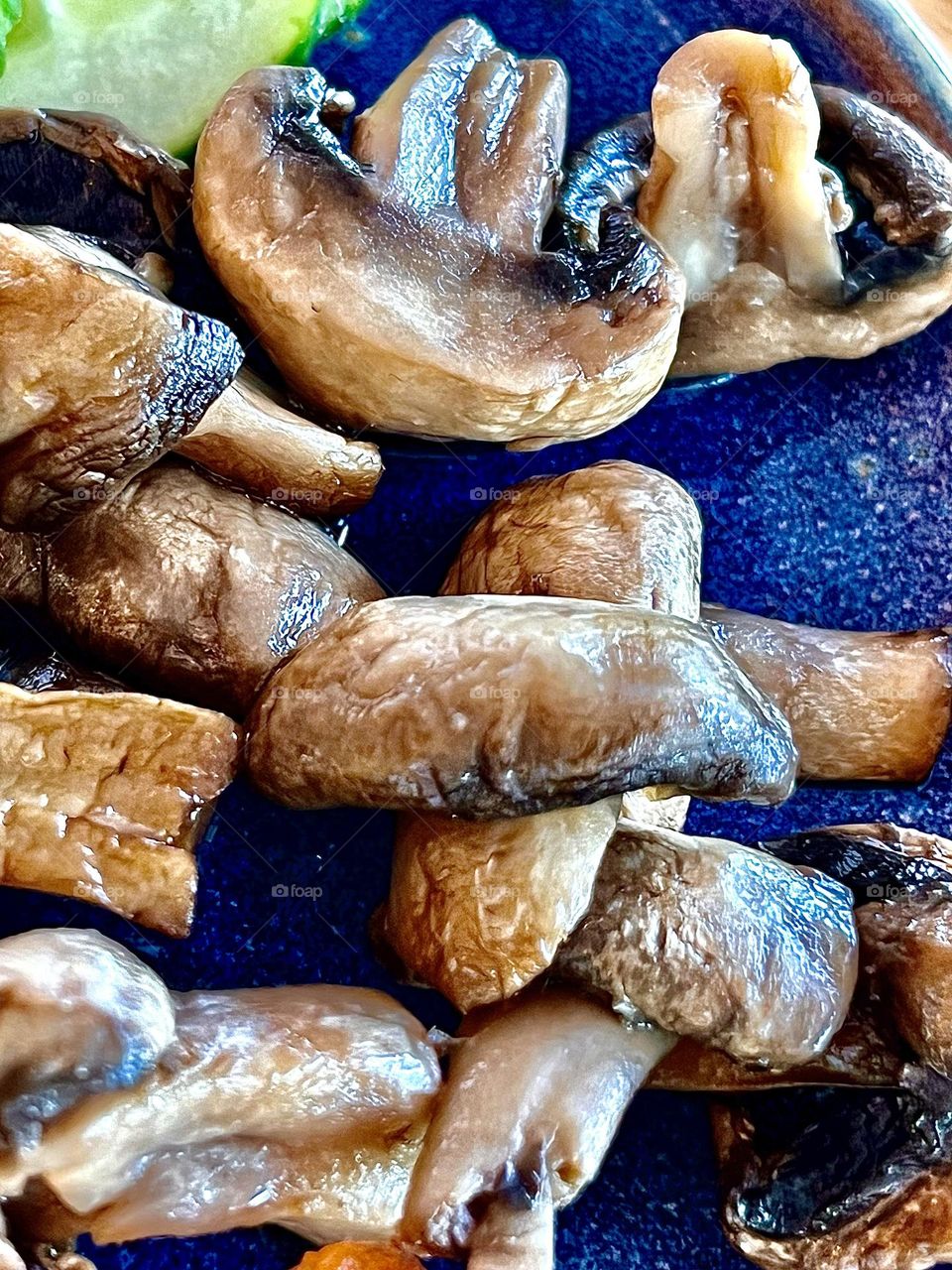 Close-up shot of mushrooms fried until golden brown
