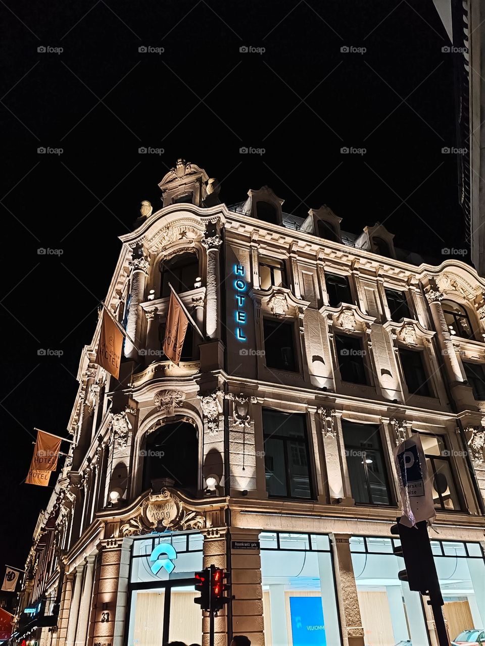 Where history meets modern elegance. The Karl Johan Hotel stands as a testament to timeless beauty, illuminated against the night sky