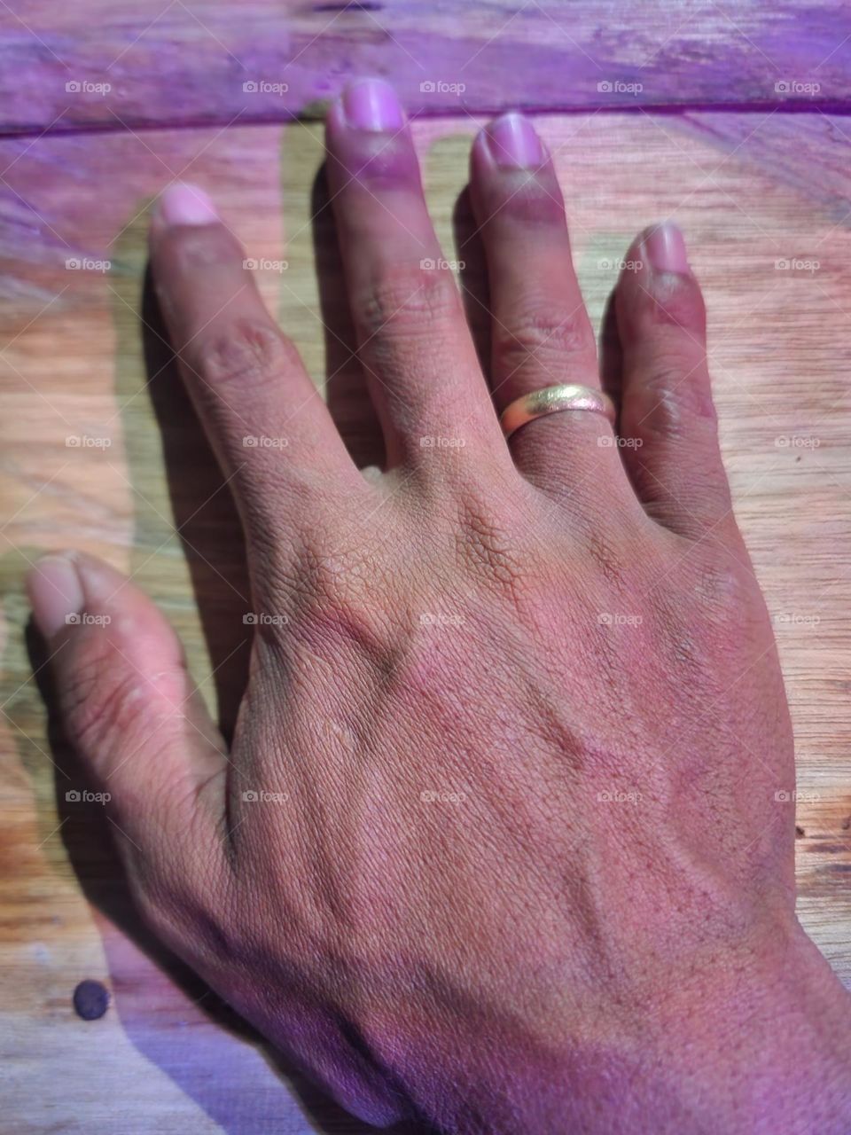 This is my finger, I took a photo on a wooden table