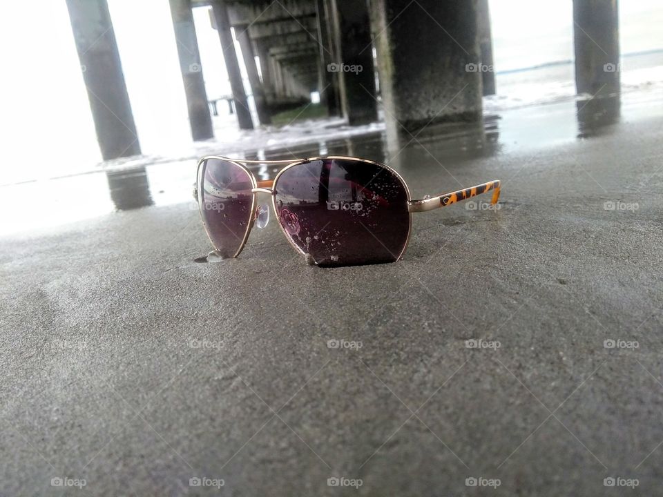 Glasses under the boardwalk