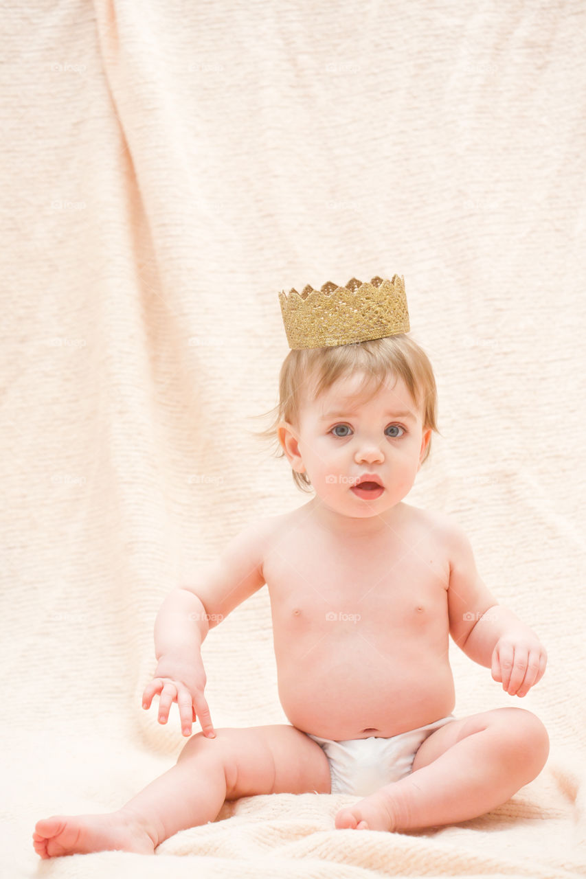queen baby. one year old little girl before smashing her birthday cake