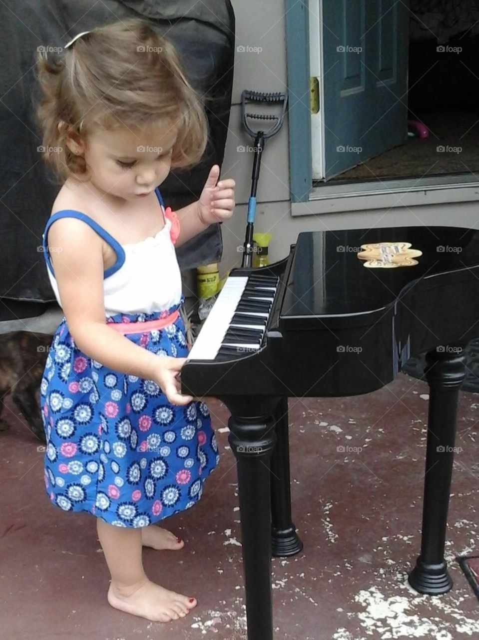 Baby girl playing piano 