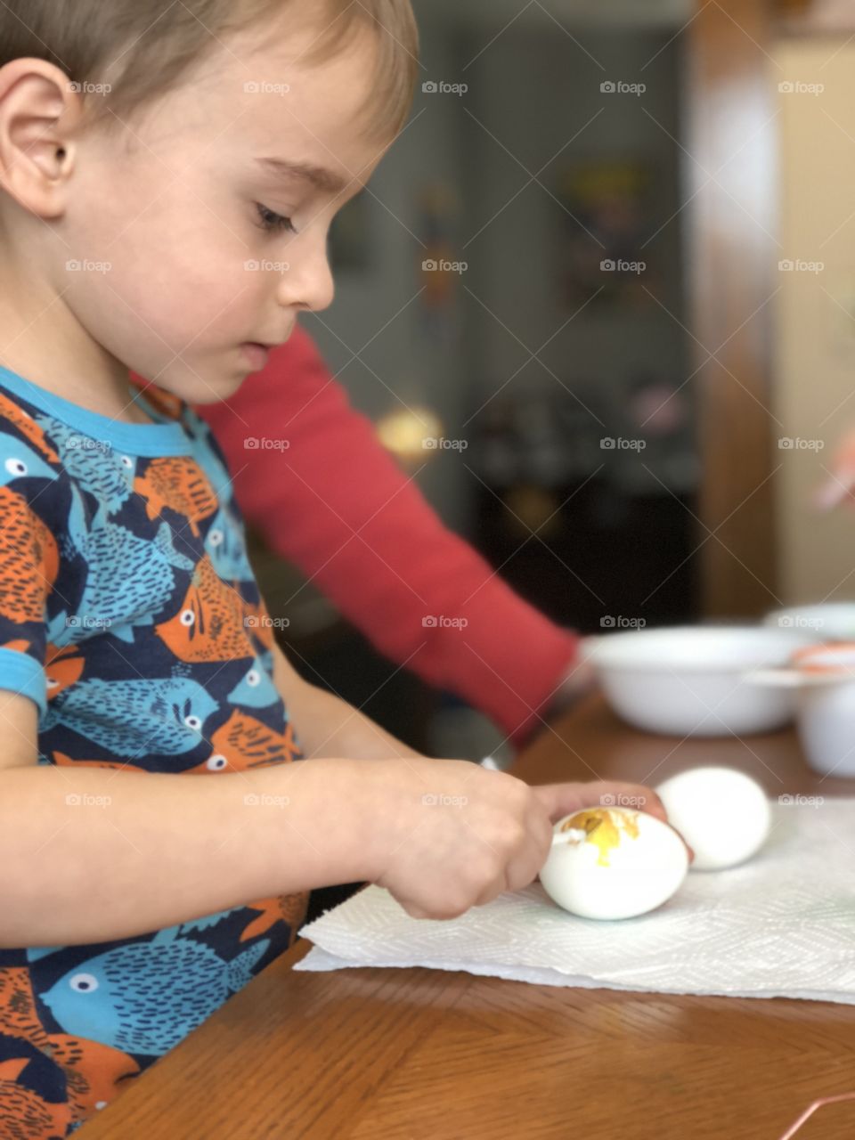 Boy coloring eggs