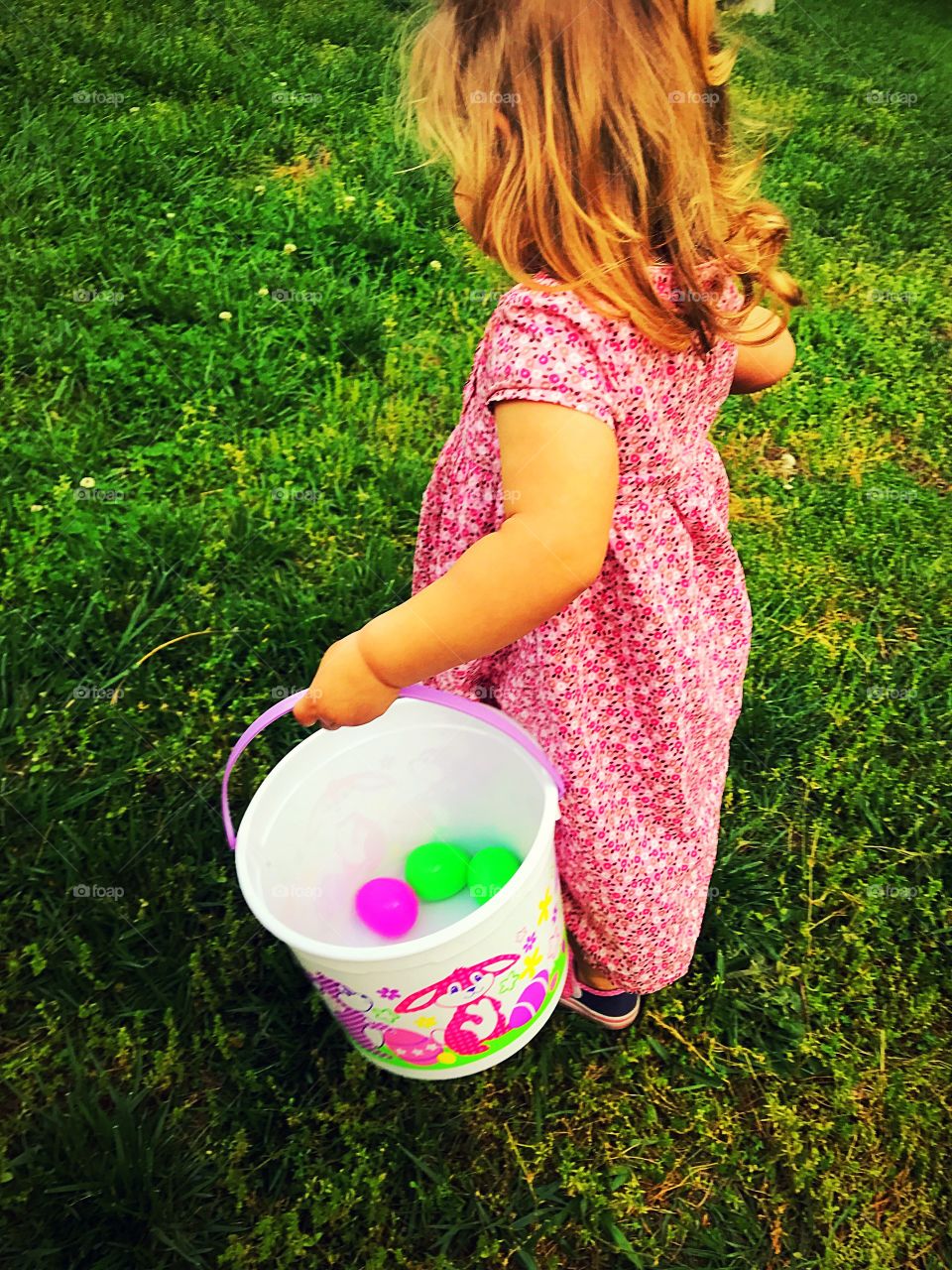 Toddler girl on Easter Egg Hunt