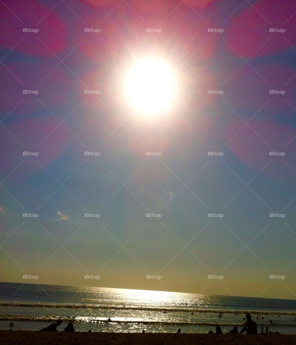 Summertime at the beach at sunset