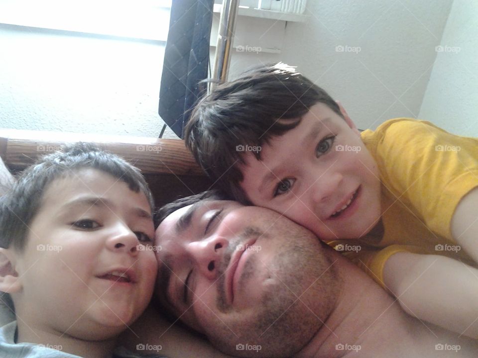 Dog pile on Daddy joyful 😊