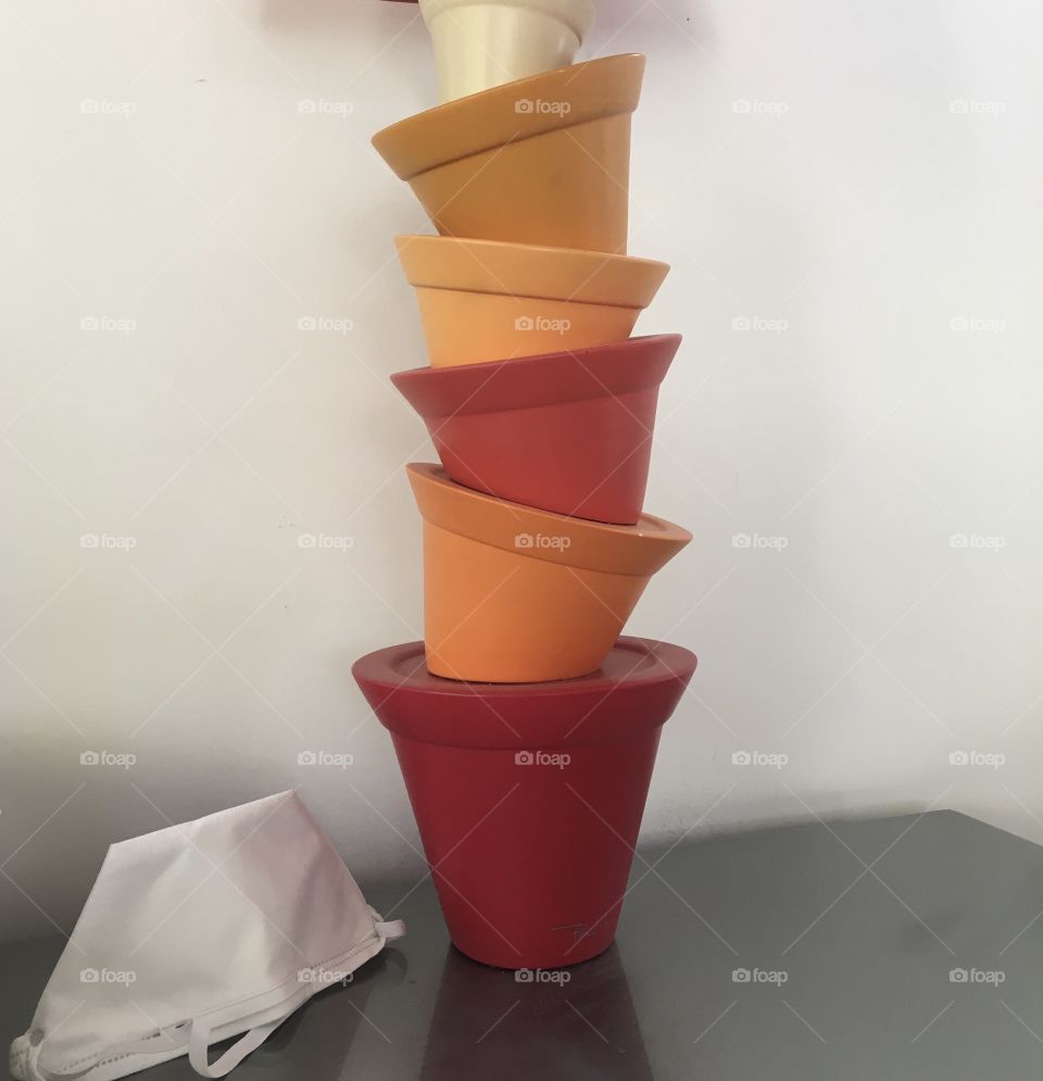 O - Orange, the color with different shades on the base of a designer lamp