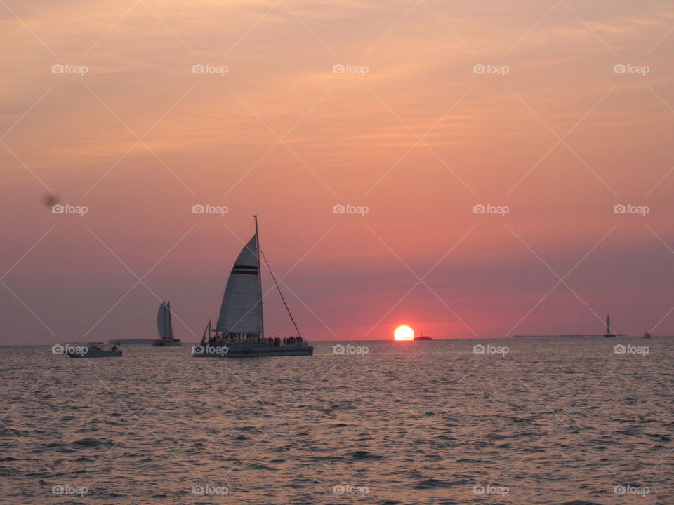 sunset boats sun water by technotimber