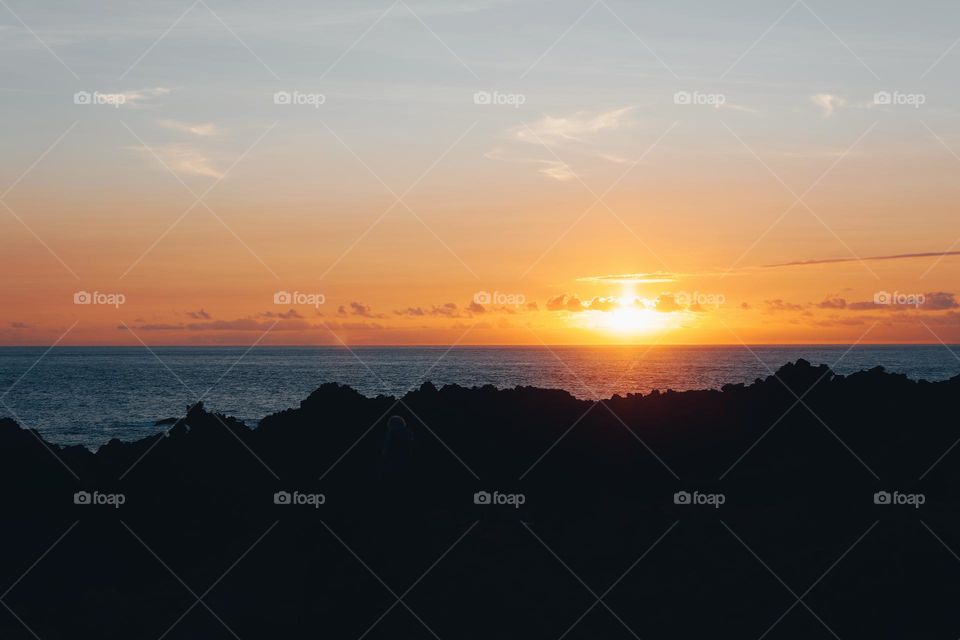 beautiful sunset on the coast of Portugal reflecting in the sea in summer