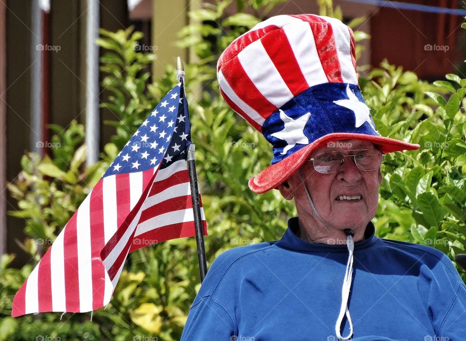 Patriotic Old Man. American Citizen Volunteering At A Voting Center