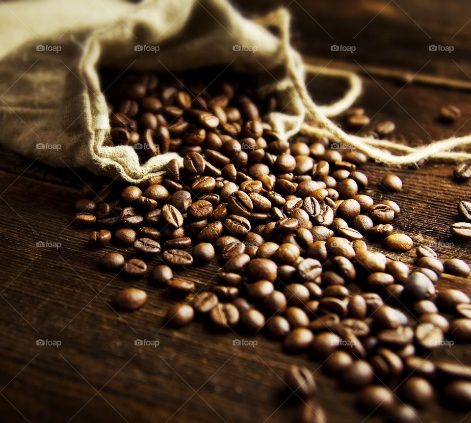 Coffee beans on wooden table
