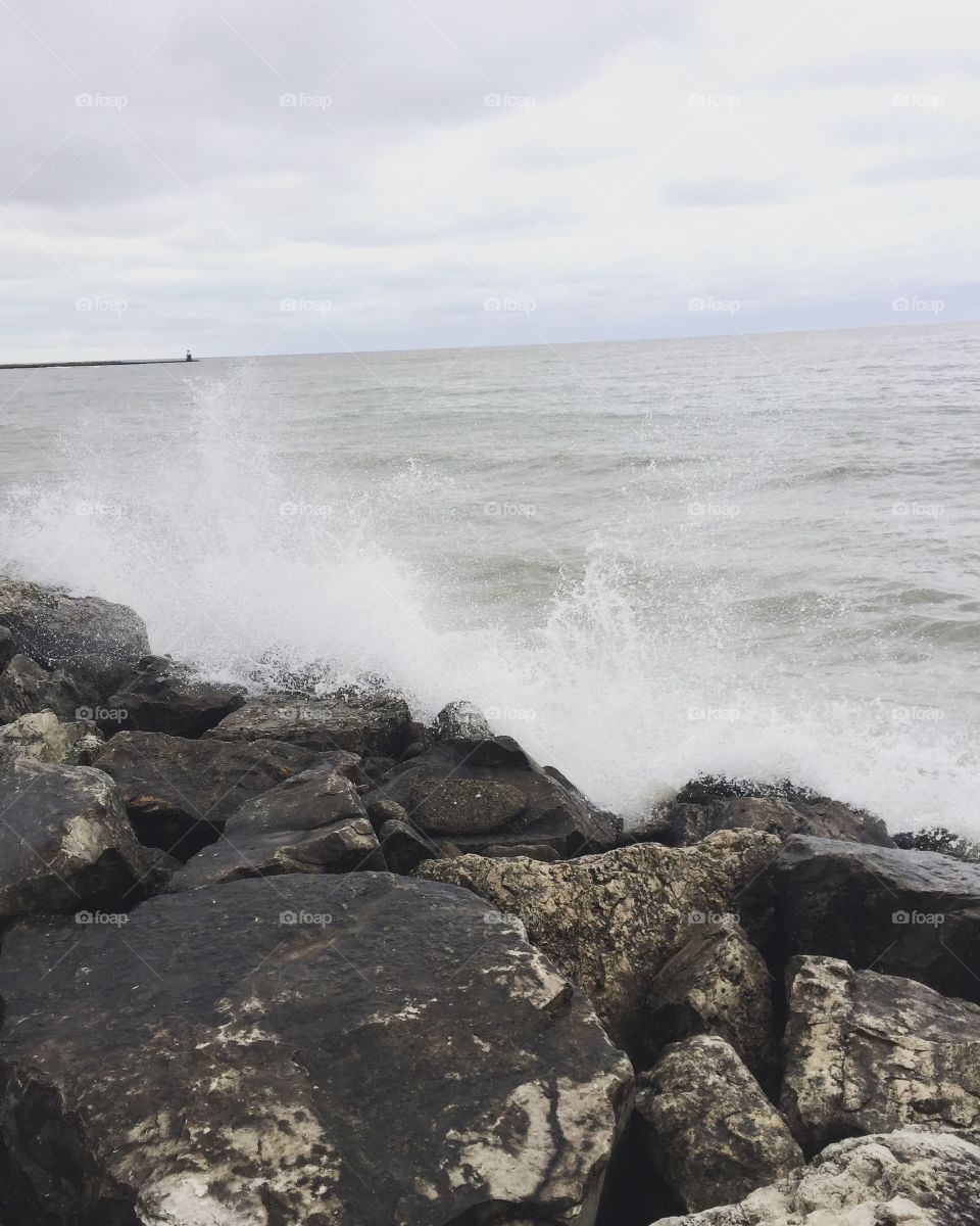 It is a cold, busy, and hectic monday afternoon. What better than the sound of Lake Michigan’s waves crashing against the rocks to bring some peace to one’s day.