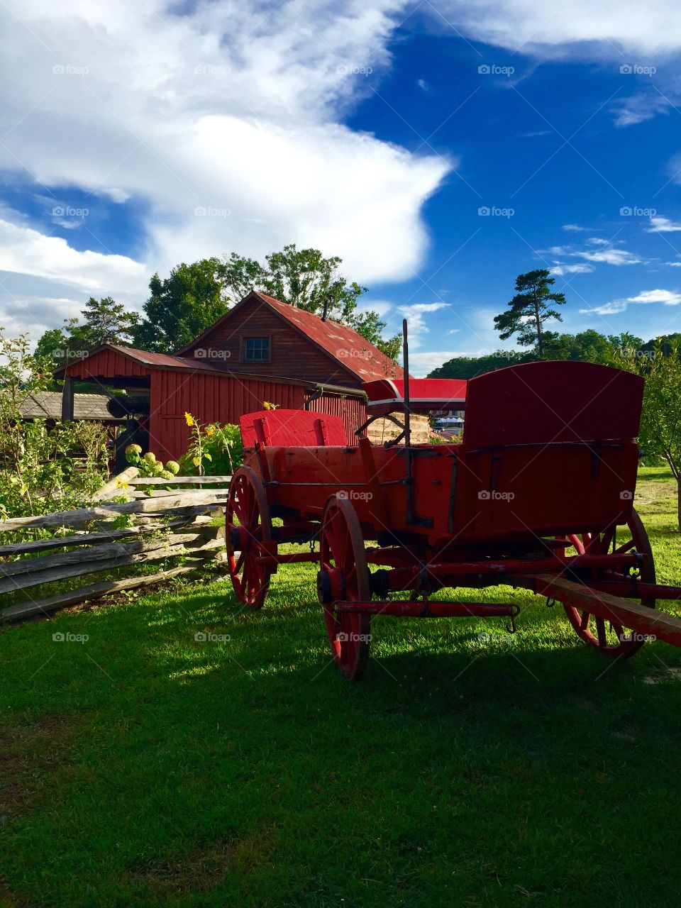 RED carriage wagon and red barn