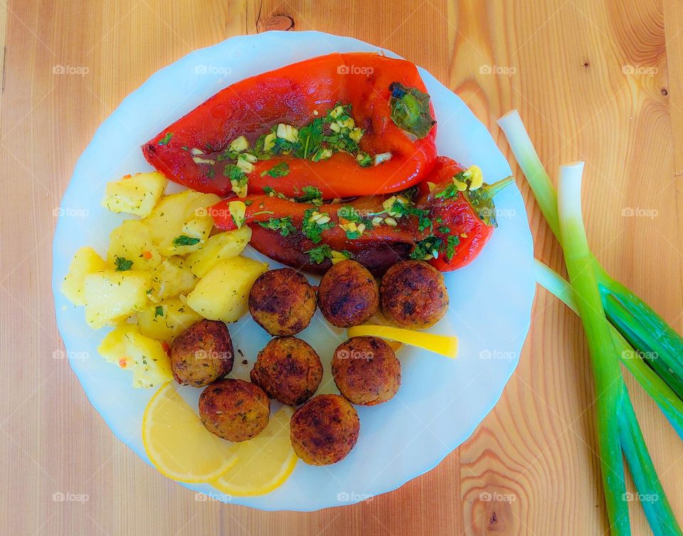 Falafel,  roasted peppers, and boiled potatoes. Delicious vegan and vegetarian food