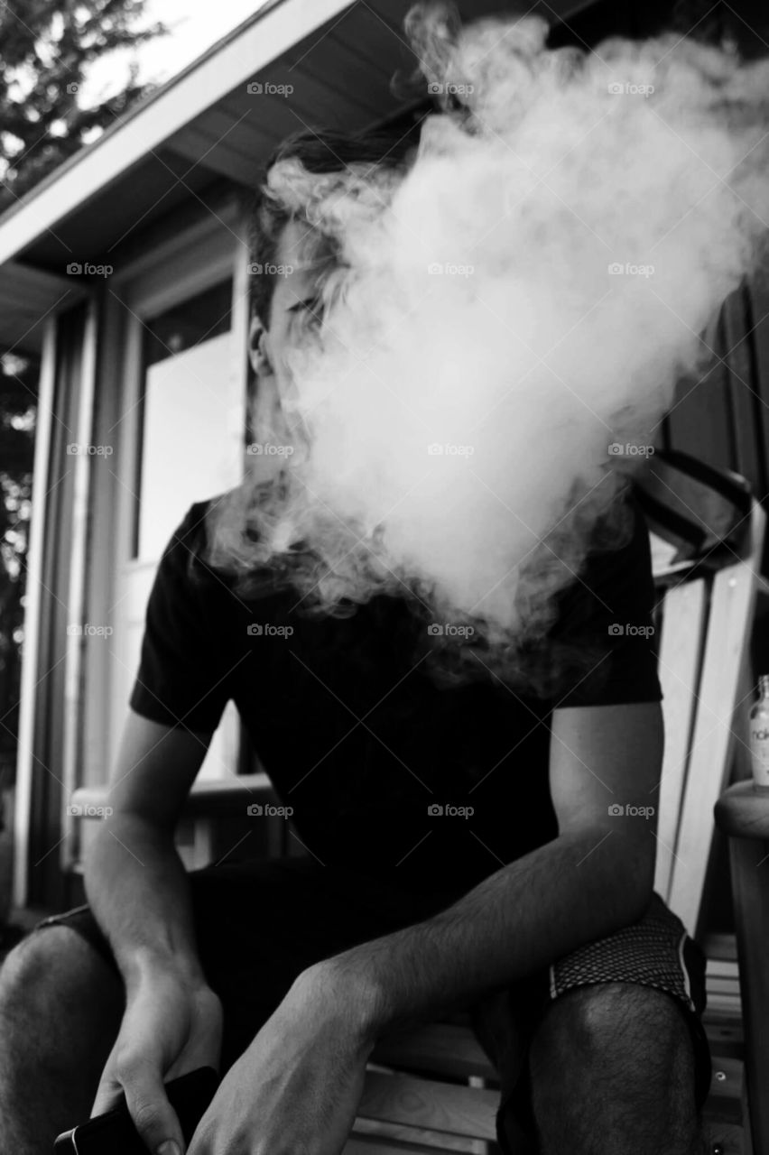 Justin hiding from the camera again! This black and white photo while providing a happy memory for me can portray many different moods which is why it is one of my favourites