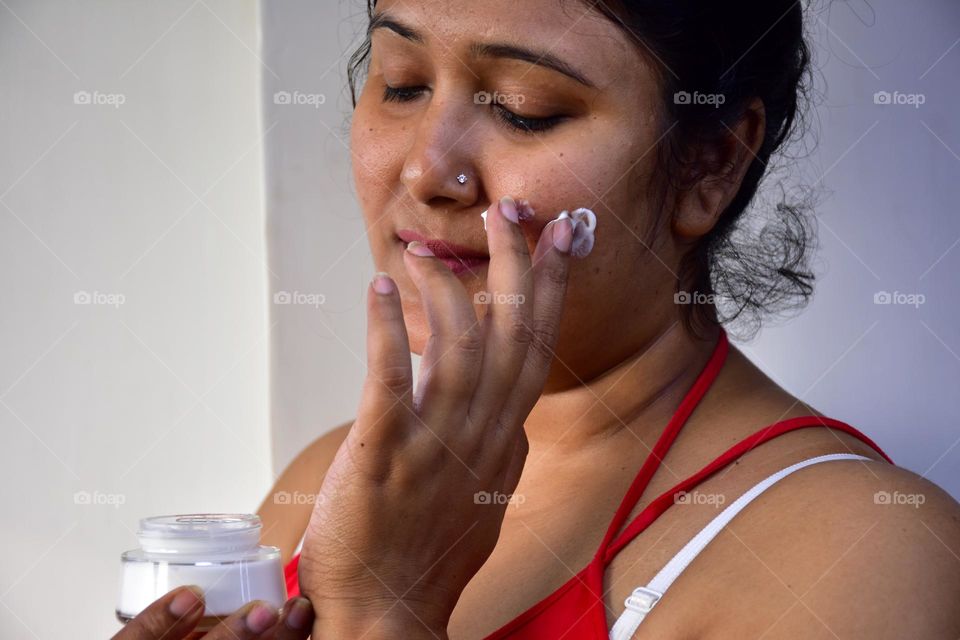 Woman applying cream