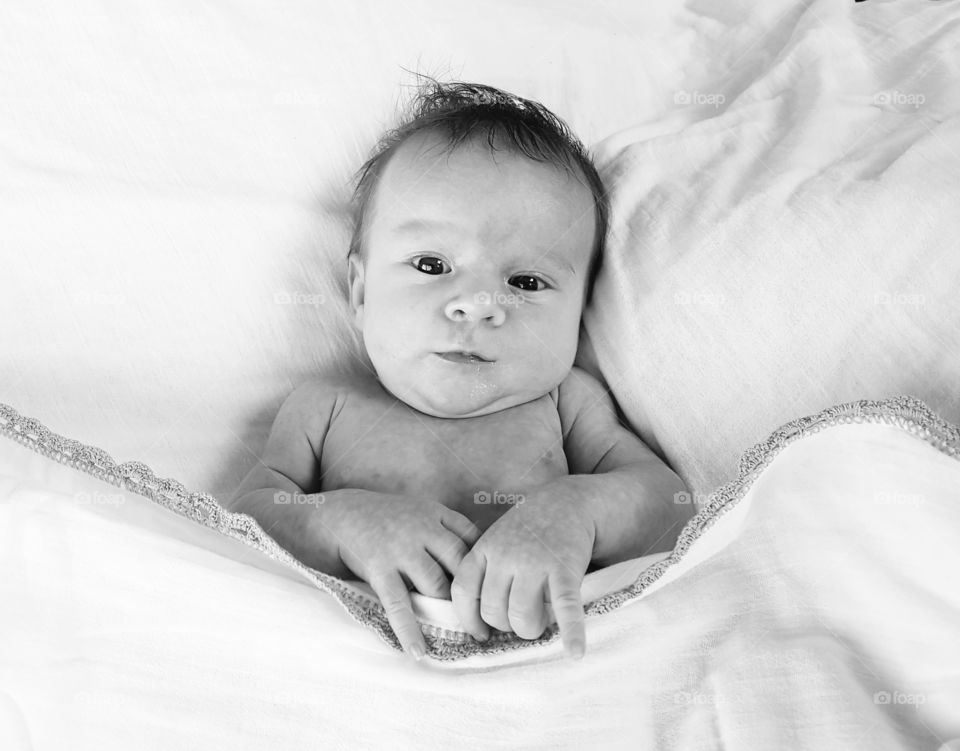 monochrome baby in bed