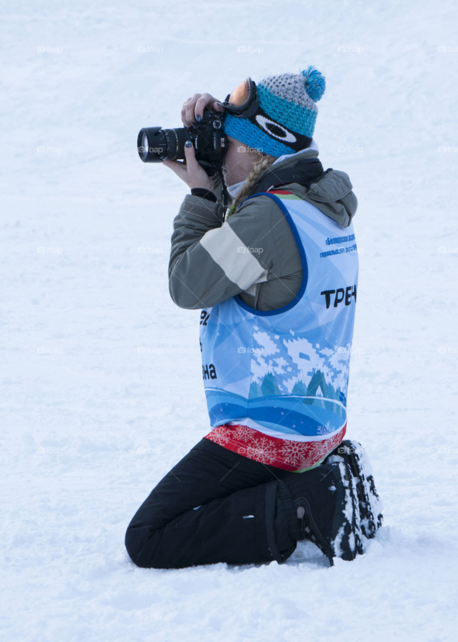 photographer taking pictures in the snow in the winter