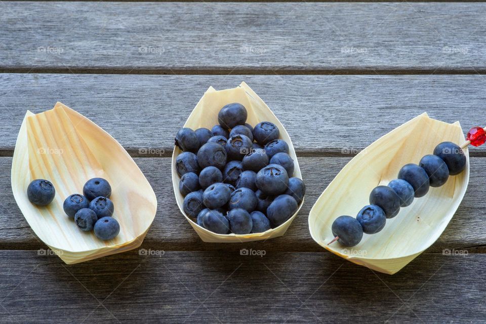 blueberries in wooden bowls