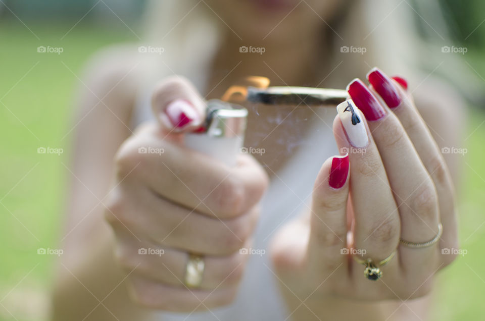 Lighting up a cannabis joint