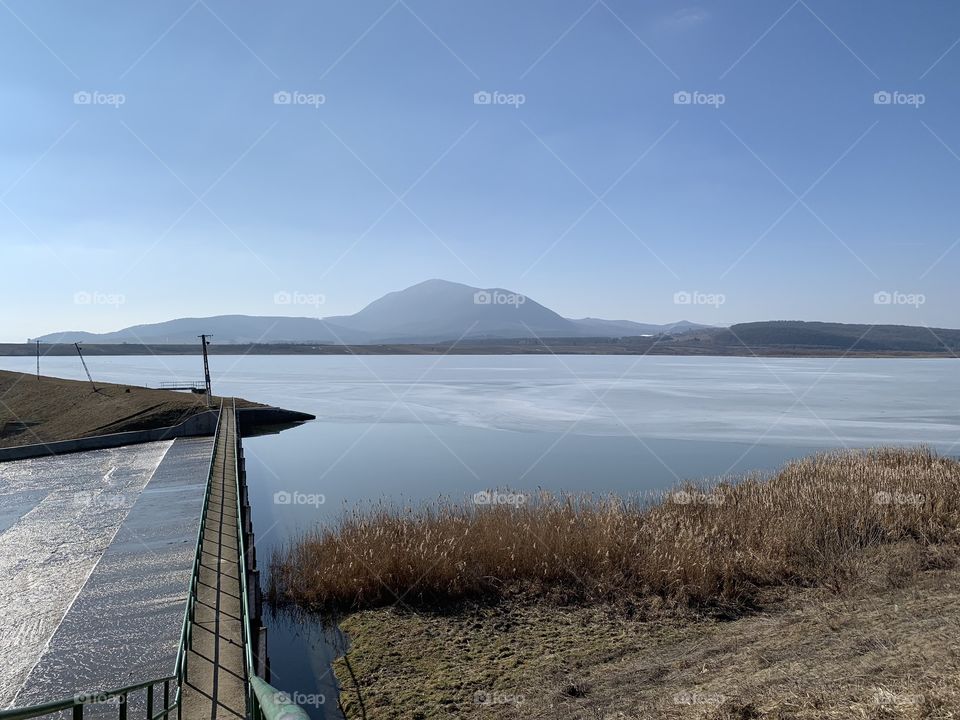 Lake view with a symmetrical bridge depth capture and mountain landscapes 