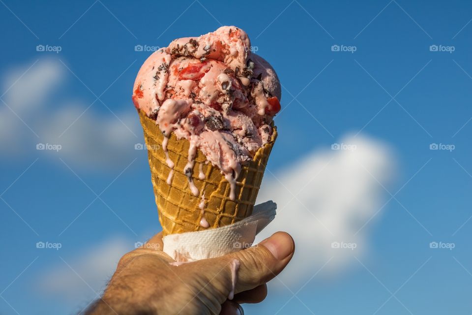 Man holding ice cream cone