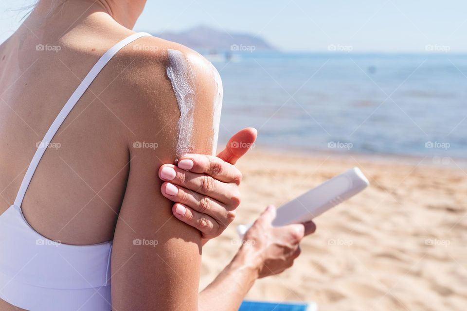 woman hand holding beauty products