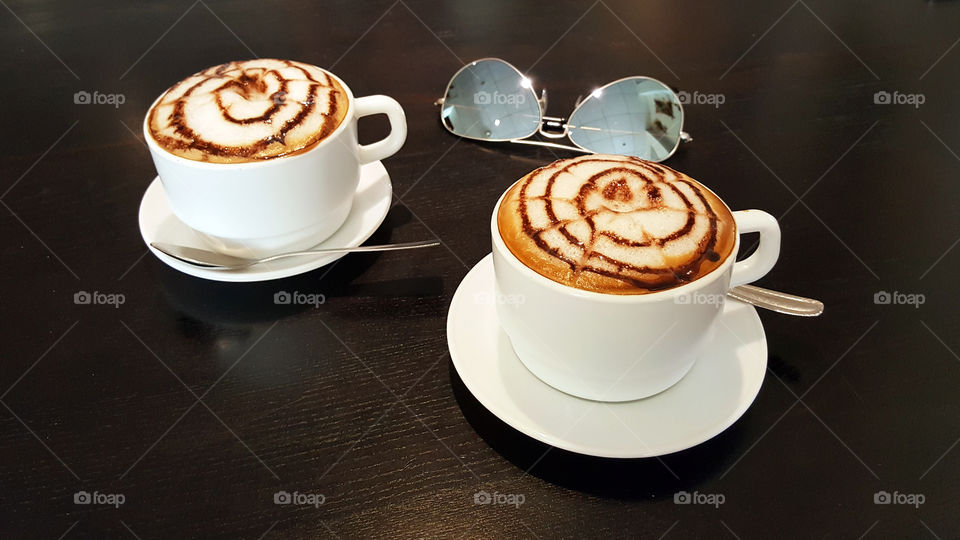 Two cups of cappuccino