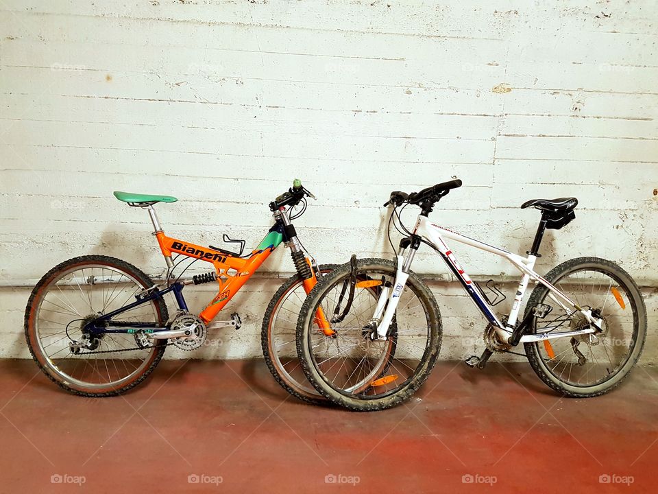 Two bicycles in a garage