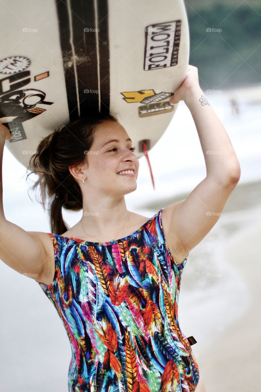 happy girl with surfboard