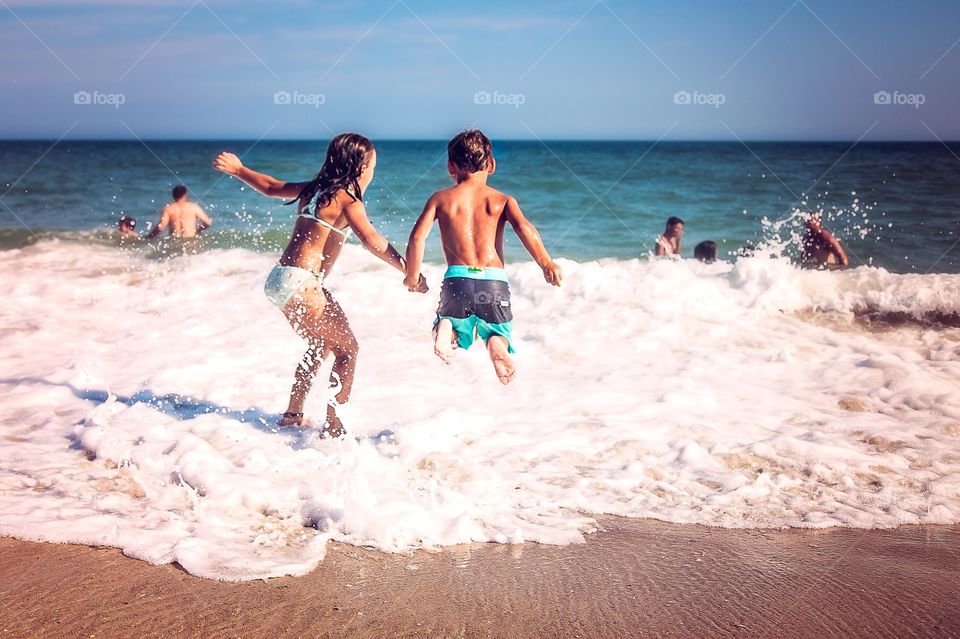 Jumping in the surf 
