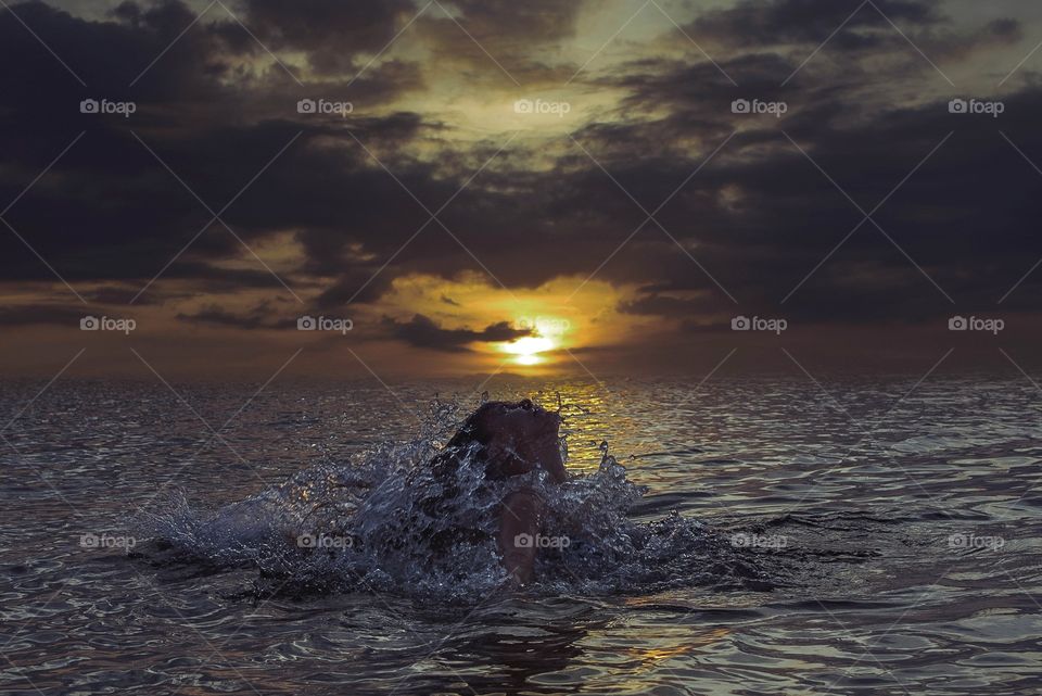 A lovely woman enjoying her bathing moment at the sea